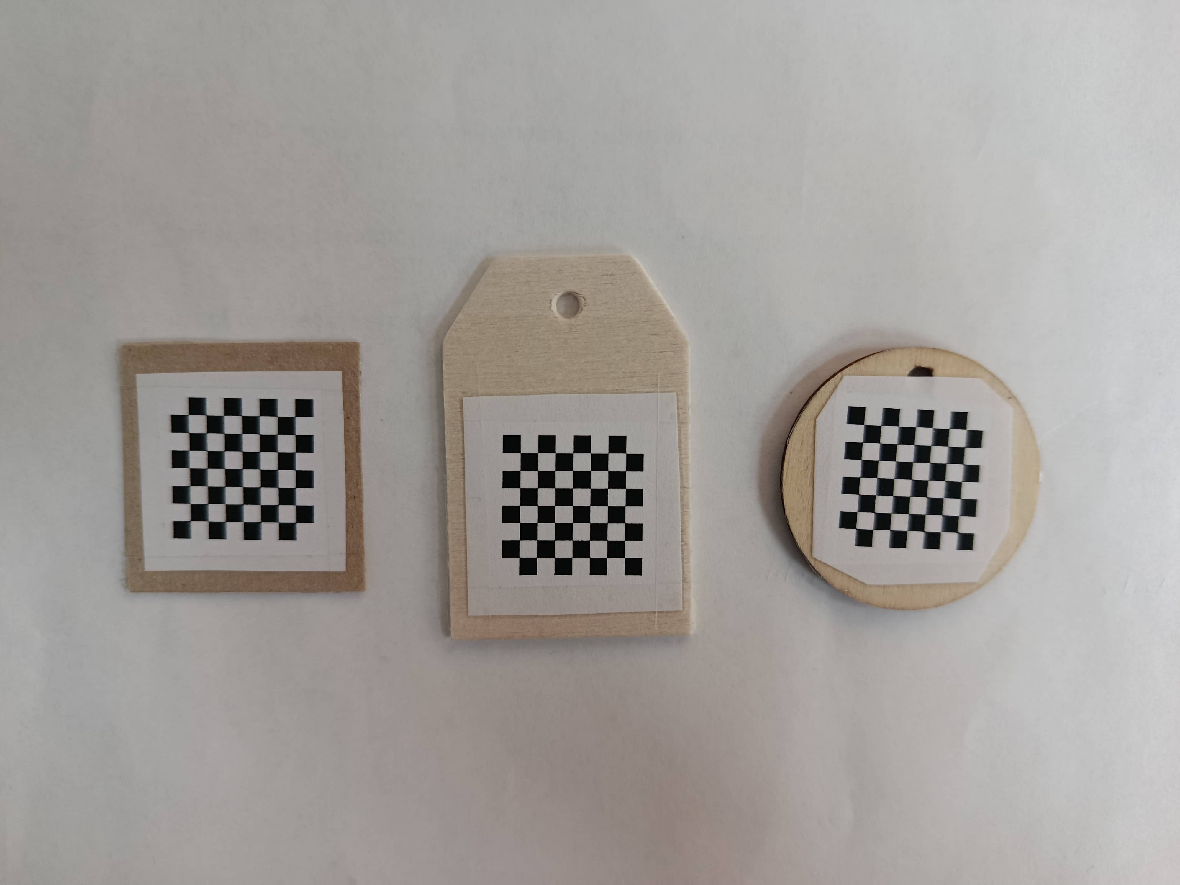 Three handmade chessboard patterns prepared for camera calibration